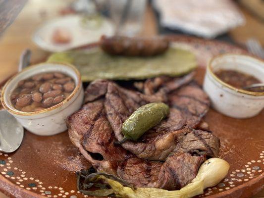 La Carne Asada Plate - 16oz thin-cut ribeye served carne asada style with nopal (cactus paddle) and chorizo