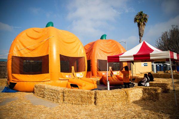 Our two inflatable pumpkin bouncers for the kiddos to bounce around in! (One token per child)