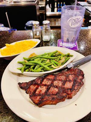 Wagyu strip steak with sautéed green beans and macaroni and cheese