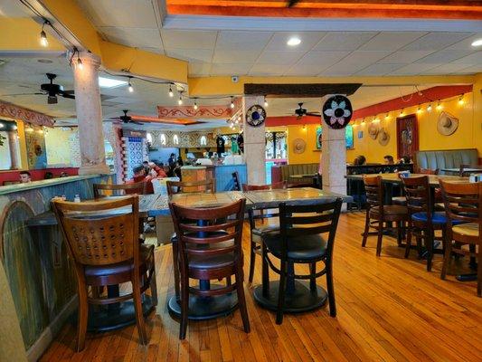 The interior, looking toward the bar and entrance. There are little burros in the lighted niches above the bar