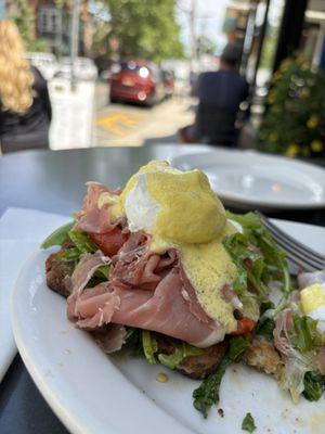 Eggs Benedict- Prosciutto, roasted red peppers, arugula. Divine.