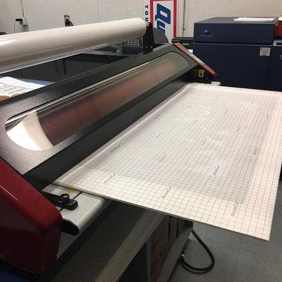 Wide formatting printing and mounting onto foam-board.