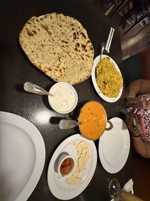 Chicken biryani, Raita shrimp tikka masala, aaloo paratha and papad with salsa. The Lassi mango drink was so good.