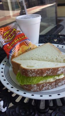 Egg salad on white bread. Came with a bag of chips, drink and a donut!