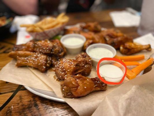 Wings. Two ranches and an icing cup  No idea why we got an icing cup.