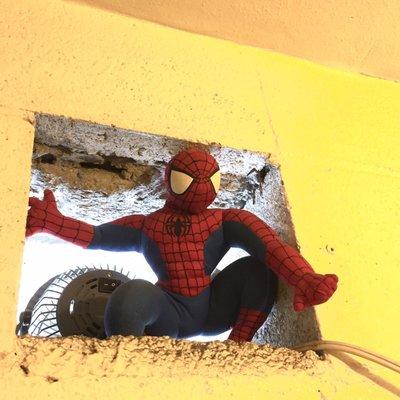 Spider Man on the lookout in the restroom vent.  LOL!