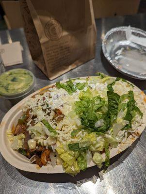 Half/half sofritas and chicken bowl with free guac from the app. Not pictured is a side of tortilla