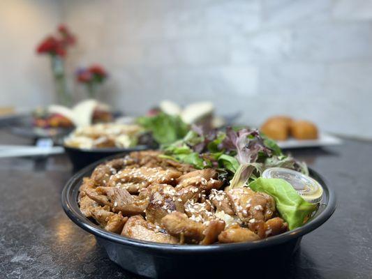 Spicy Yuzu Grilled Chicken Rice Bowl with a house sesame salad.