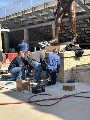 Installation of a statue honoring Bob Kalsu at Del City High School