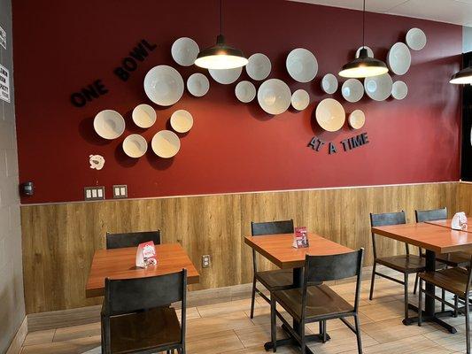 Seating area with bowl decoration in the background