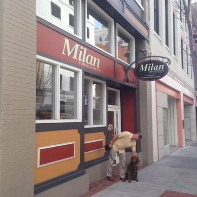 Milan Tobacconists' co-owner David with store welcome wagger Freya prepare for a stroll in downtown Roanoke.  Well-behaved dogs are welcome!