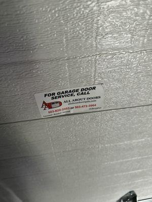 Company sticker covering area of damage