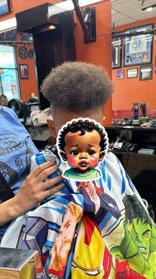 Toddler's first haircut at the barber shop