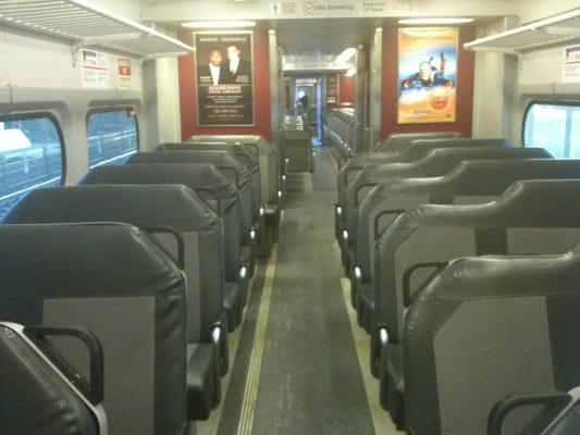 Seats on one of the older trains.