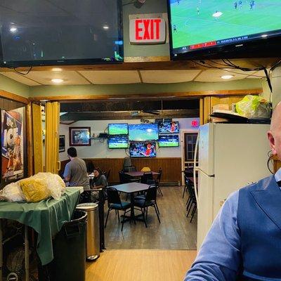 Fridge in the dining/bar area - what's up with that table full of ??