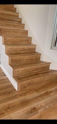 Manila Oak on stairs, although the stairs don't have the railing in this picture you can see the meticulous work of our installers.