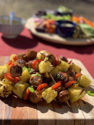 Red Pepper Chicken Sausage and Pineapple Mini-Skewer drizzled with Habanero Honey