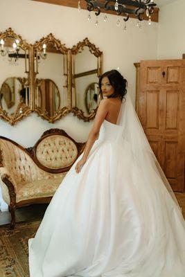 Stunning photo of our bride in the bridal suite before having her first look with the groom at McGuire's Millrace Farm.  Katie Wood Photo