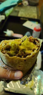 Beef burrito with salsa added.