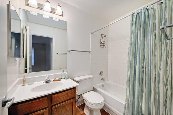 Full bathroom with large mirror and separate vanity