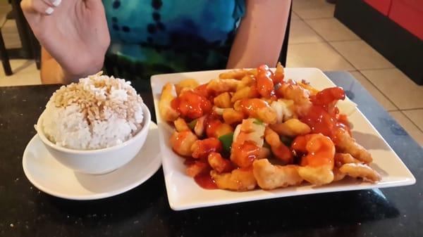 Sweet & Sour chicken with fried rice.  The meal also includes soup or a pretty big lettuce salad.