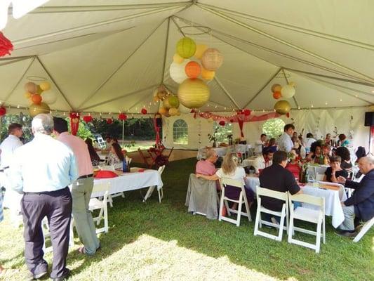 40x40 frame tent; 8 ft. banquet tables with white farmhouse chairs (worth the upgrade!)