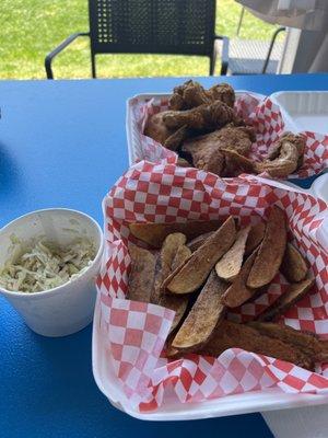 Delicious fried chicken, coleslaw and JoJo Fries.