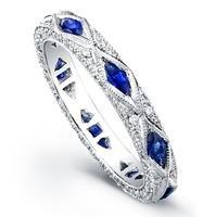 Vintage influence with diamond shaped royal blue sapphires surrounded by pave diamonds and hand engraving.