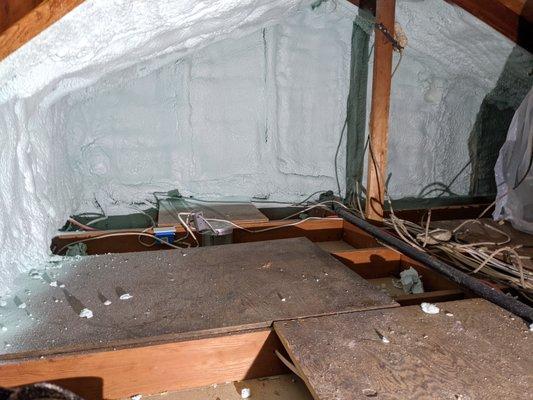 Spray foam in the attic along another gable wall.