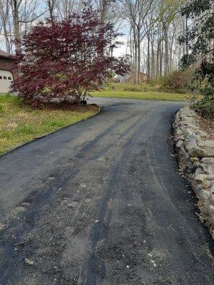 The asphalt was too cold when laid and the thickness was inconsistent throughout.