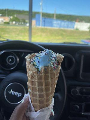 Junior Cookie Monster waffle cone with rainbow sprinkles