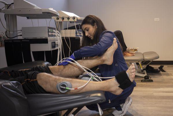 Nurse applying advanced electrical signaling therapy to speed healing and recovery