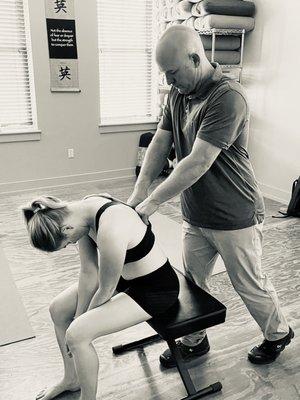 Jason Watford Structural Integrator works the back muscles to enhance the clients movement and function.