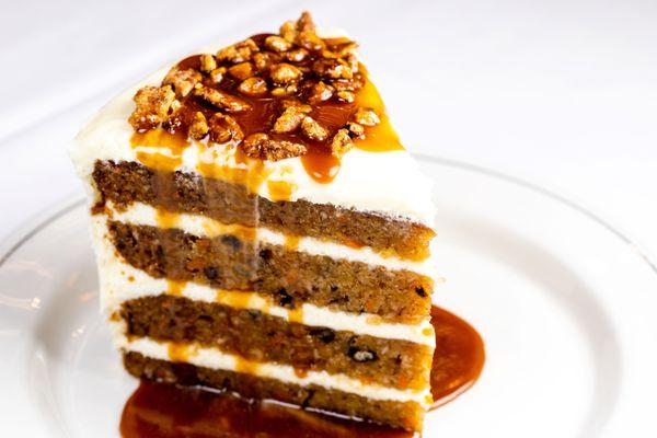 WORLD CLASS CARROT CAKE cream cheese icing, spicy pecans and warm butterscotch