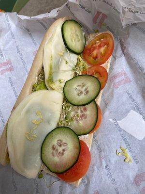 Veggie sandwich with such bad cucumbers.