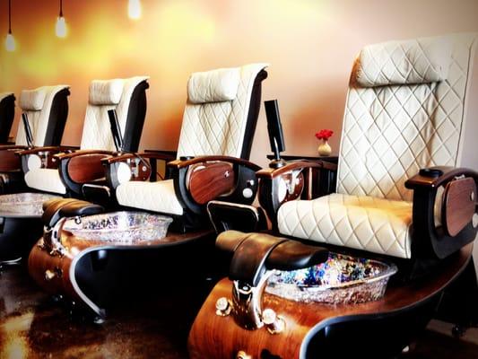 Relax in the luxurious glass bowl pedicure chairs!