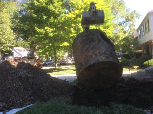 Pulling the underground storage tank from the ground. It's very big.