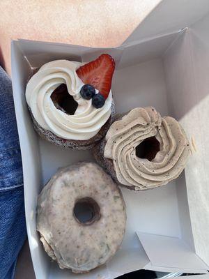 Berries and cream donut. Coffee cream Cronut. Peach and basil donut.