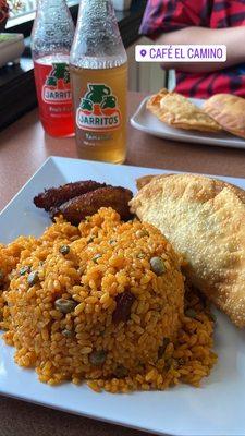 Beef and pizza empanadas, sweet plantains, and arroz con gadules