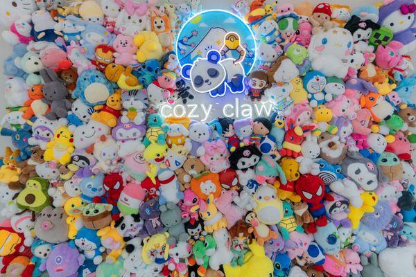 cozy claw plushie wall for selfies and group photos! Take a photo and tag us at @cozy_claw to be featured on our social media!