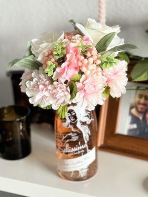 Champagne bottle bouquet made from flowers & foam