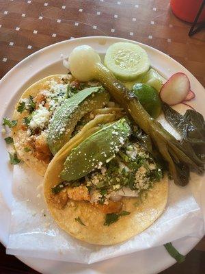 Grilled chicken tacos with cheese and avocado