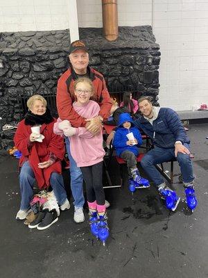 Family photo in front of the fireplace