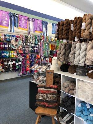 Wide selection of yarns and wool roving.