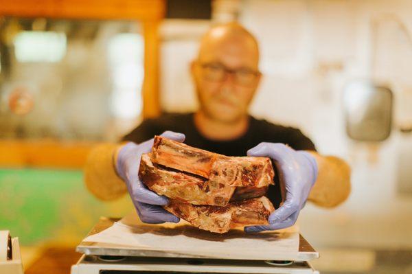 Steaks being weighed at butcher shop