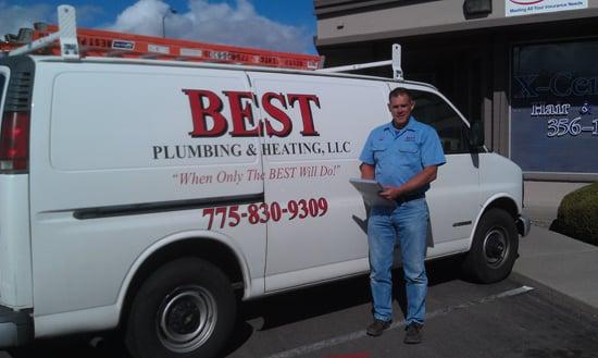 Joe of Best Plumbing & Heating, LLC next to one of his vehicles.