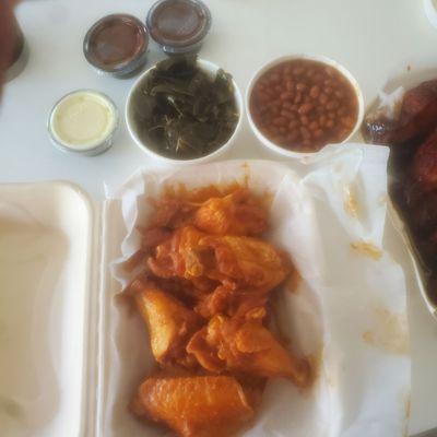 Buffalo sauce chicken wings. Also baked beans and collard greens which were sides with our ribs