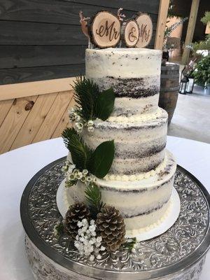 Three tiered naked chocolate wedding cake