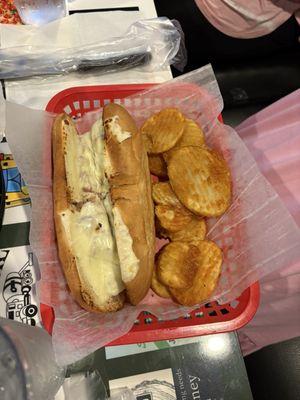 Philly cheesesteak sandwich with fries