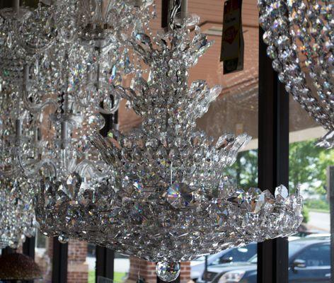 Gorgeous all crystal chandeliers in the windows at Lux Lighting